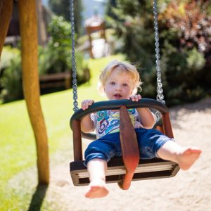 little-boy-on-the-swing-at-the-playground-PZ5DNSW.jpg